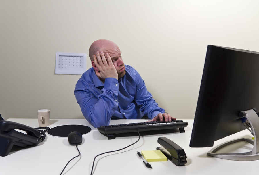 Bored man at work in an office