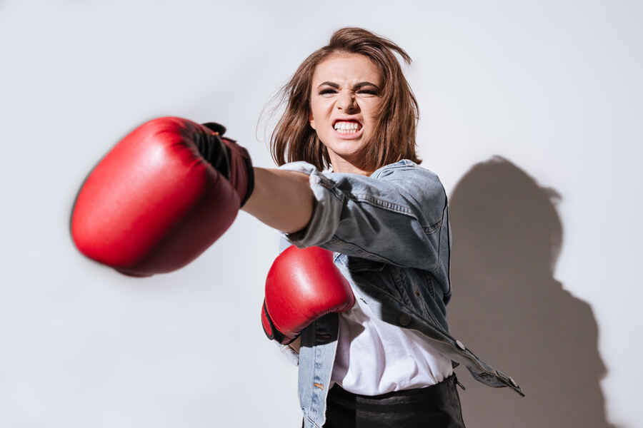 Fighting spirit shown as women with boxing gloves