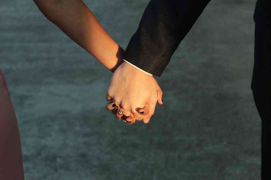 Couple holding hands