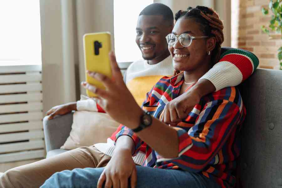 Couple taking a selfie together looking happy