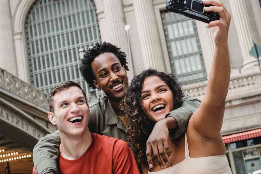 Group of happy friends taking a selfie