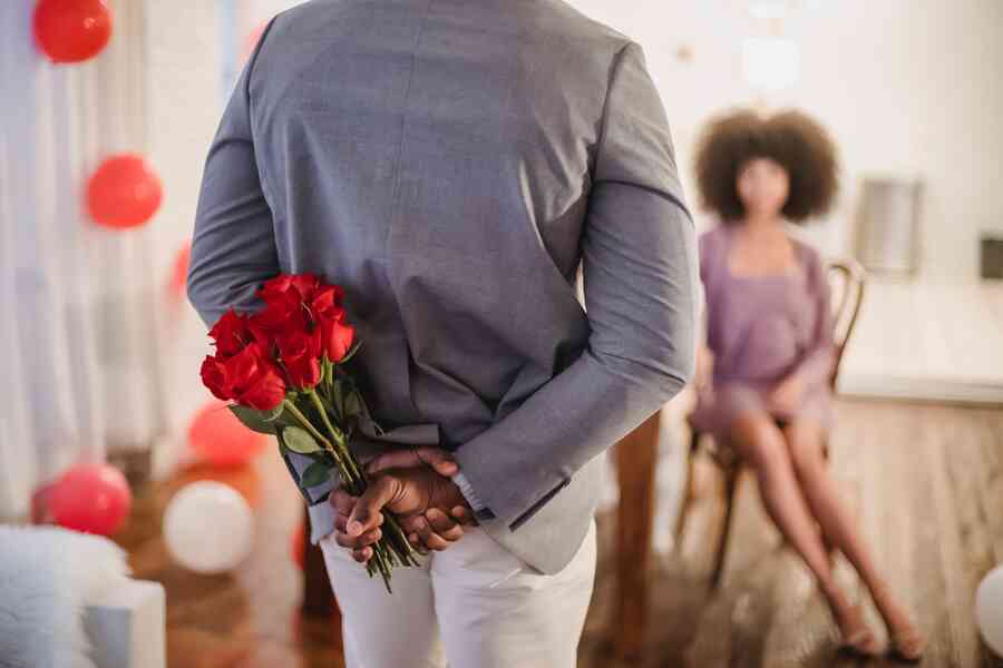 Man giving a woman flowers