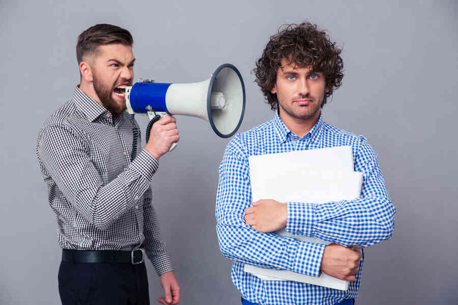 A direct person speaking to another using a megaphone