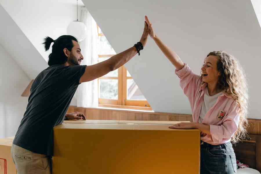 Couple working together as they move home