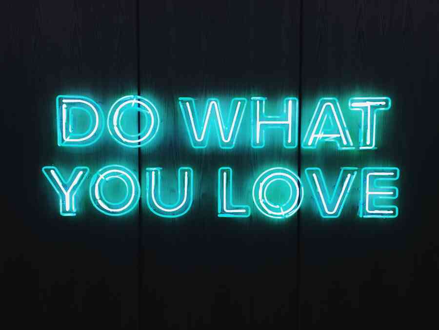 A neon sign spelling out the phrase 'do what you love'