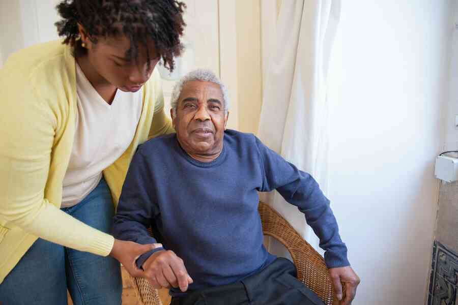 Woman helping an elderly family member