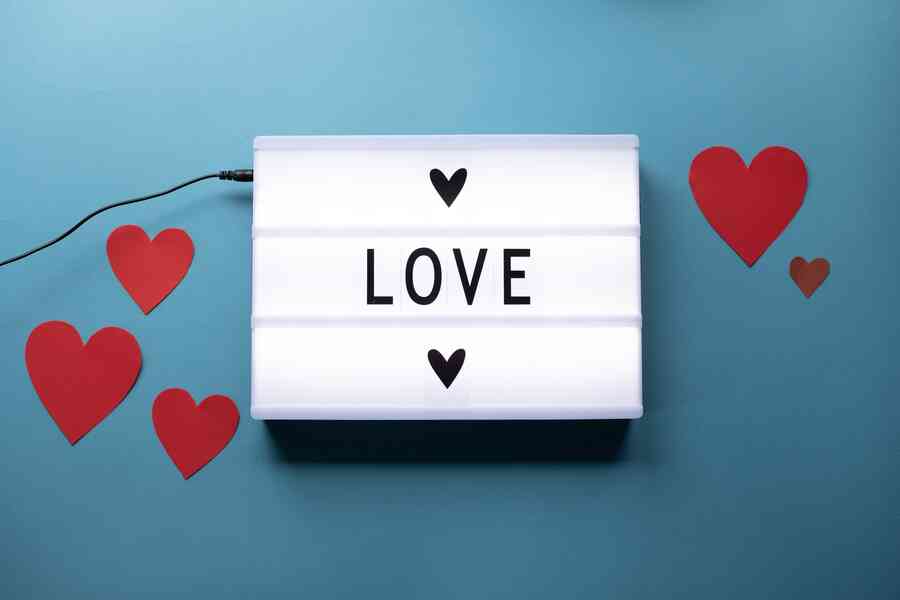 I love you on lightbox with paper hearts