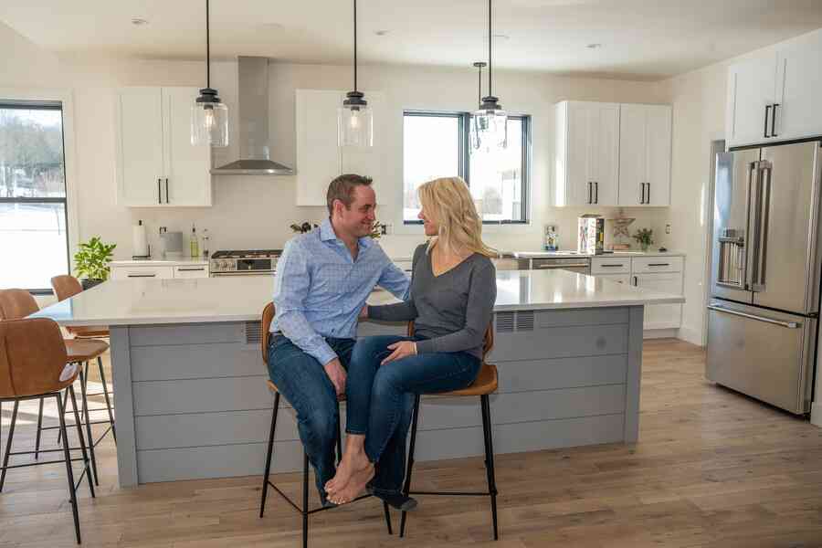 A couple looking happy in their home