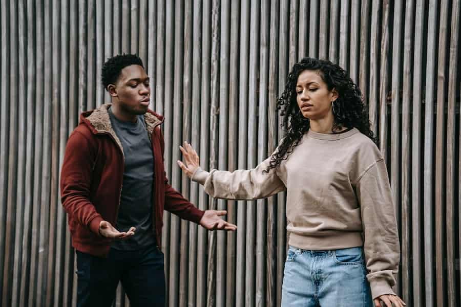 Couple having conflict on street