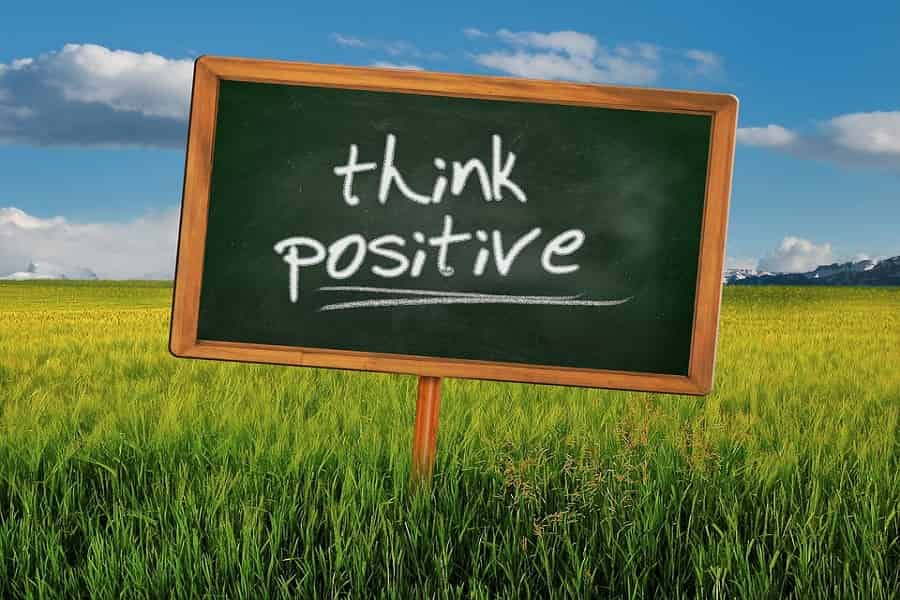 Think positive sign in open field