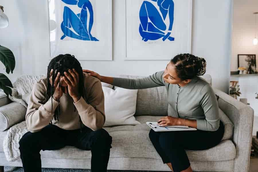 Woman consoling man