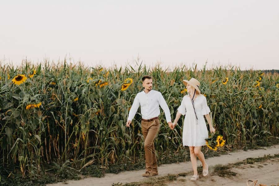 Couple holding hands while walking