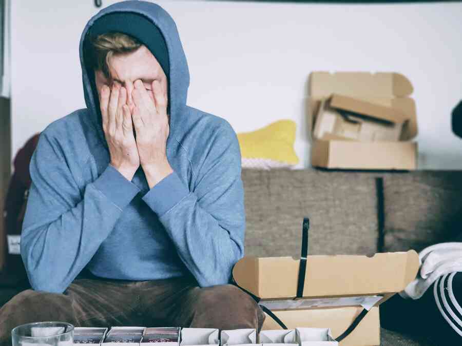 Upset man with his head in his hands