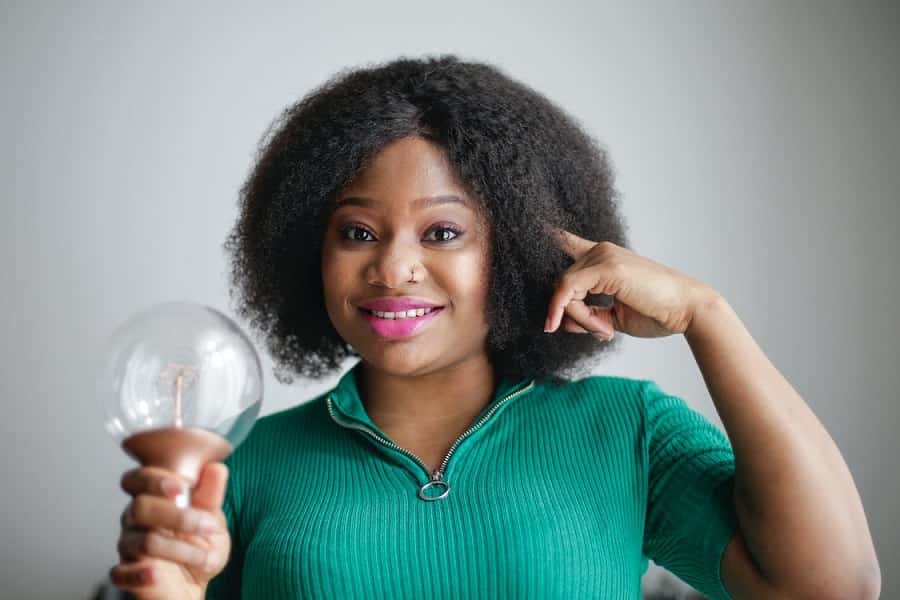 Woman holding light bulb